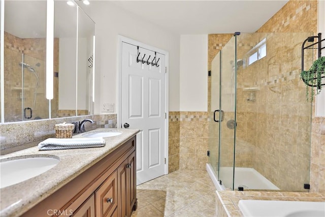 5066 N Nearglen Ave, Covina, CA 91724 - full bathroom with double vanity, a shower stall, a bath, and tile walls