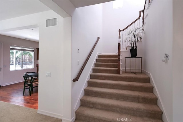 15681 Canon Ln, Chino Hills, CA 91709 - stairs with carpet flooring and wood finished floors