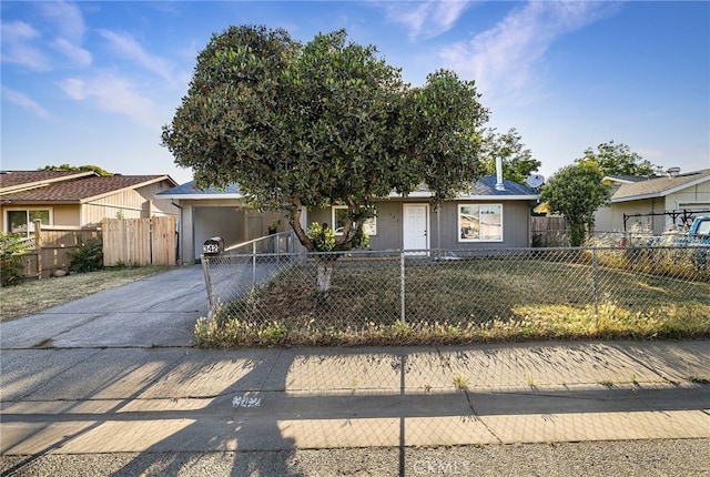 342 Rio Vista Ct, Corning, CA 96021 - view of front facade featuring concrete driveway, a fenced front yard, and a carport