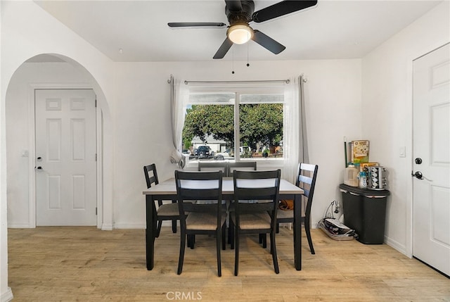 342 Rio Vista Ct, Corning, CA 96021 - dining space featuring arched walkways, light wood finished floors, and ceiling fan