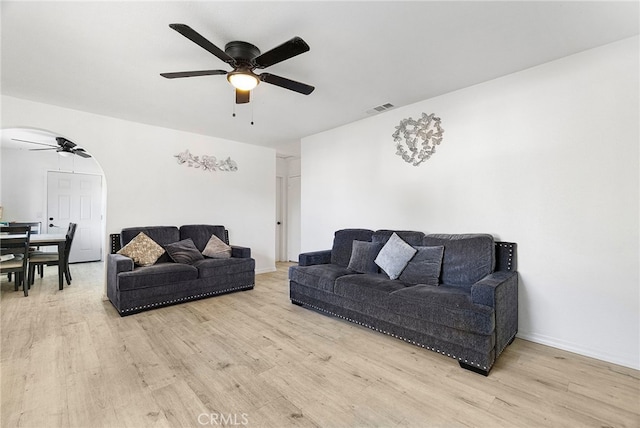 342 Rio Vista Ct, Corning, CA 96021 - living area featuring ceiling fan, wood finished floors, and arched walkways