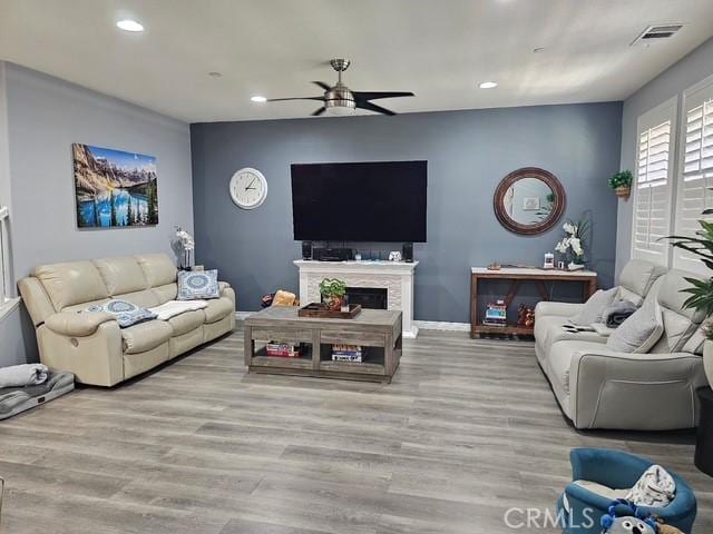 16001 Chase Rd Unit 111, Fontana, CA 92336 - living area featuring a ceiling fan, recessed lighting, wood finished floors, and a fireplace