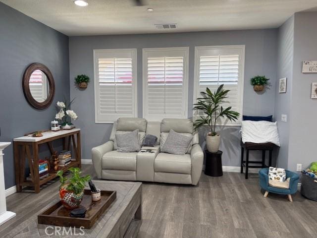 16001 Chase Rd Unit 111, Fontana, CA 92336 - living area with wood finished floors, healthy amount of natural light, and recessed lighting