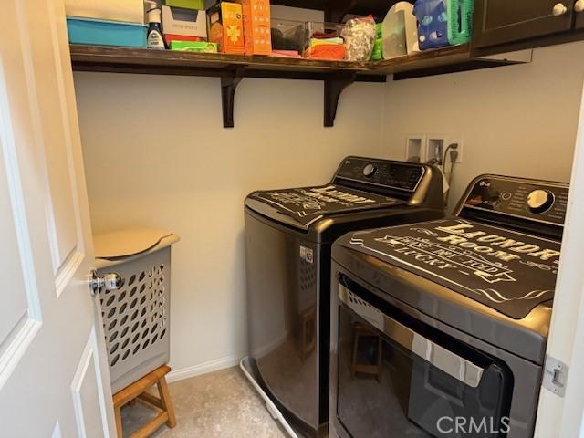 16001 Chase Rd Unit 111, Fontana, CA 92336 - laundry room featuring separate washer and dryer and cabinet space