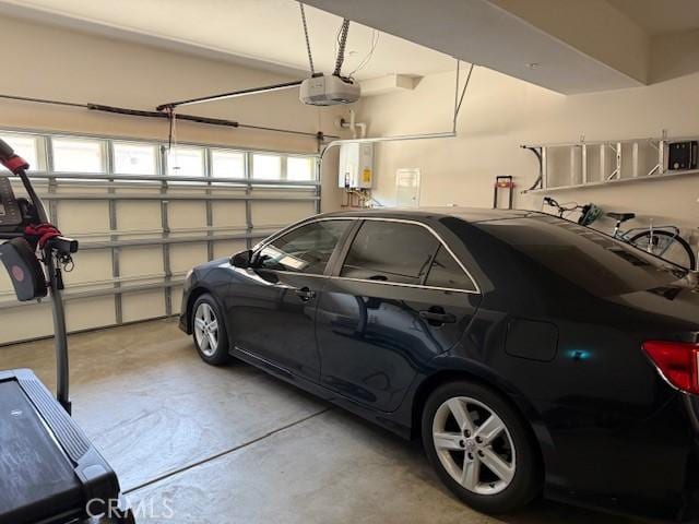 16001 Chase Rd Unit 111, Fontana, CA 92336 - garage with a garage door opener and water heater