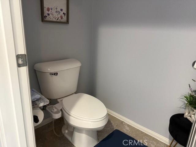 16001 Chase Rd Unit 111, Fontana, CA 92336 - bathroom with toilet and baseboards