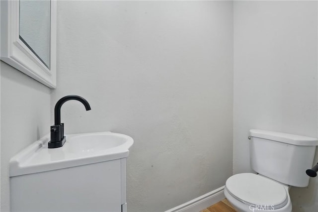 1717 Norval St, Pomona, CA 91766 - half bathroom featuring vanity and wood finished floors