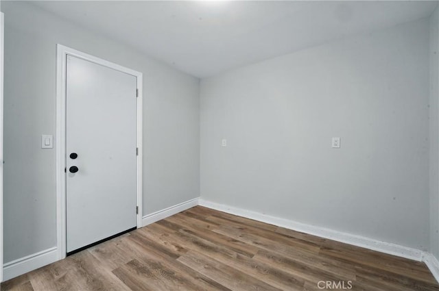 1717 Norval St, Pomona, CA 91766 - empty room featuring wood finished floors and baseboards