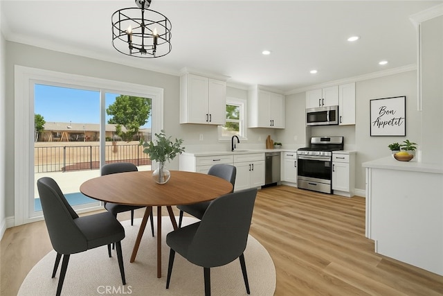1717 Norval St, Pomona, CA 91766 - dining room featuring crown molding, light wood-style floors, a chandelier, and recessed lighting