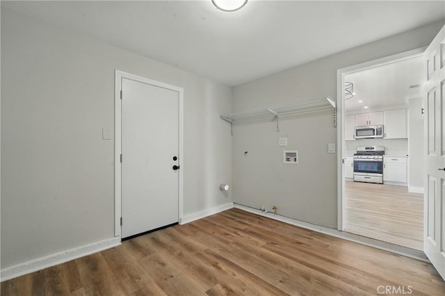 1717 Norval St, Pomona, CA 91766 - laundry room with hookup for a gas dryer, hookup for a washing machine, and light wood-type flooring