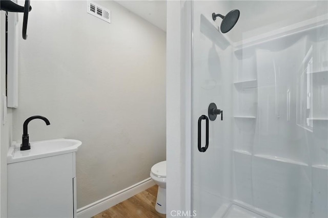1717 Norval St, Pomona, CA 91766 - bathroom with a shower stall, wood finished floors, and vanity