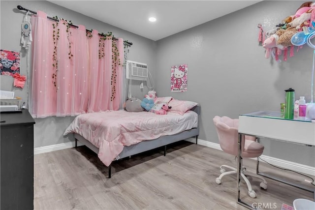 1109 Broadmoor Ave, La Puente, CA 91744 - bedroom with wood finished floors and a wall mounted AC