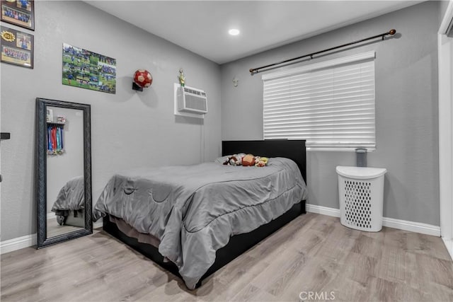1109 Broadmoor Ave, La Puente, CA 91744 - bedroom with wood finished floors, an AC wall unit, and recessed lighting