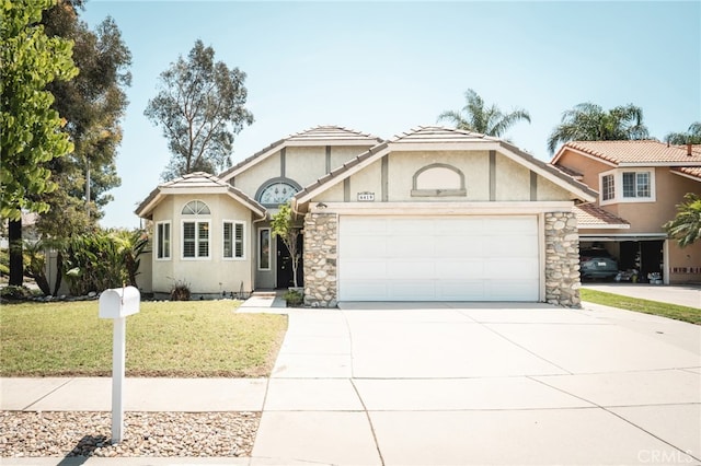 6419 Panorama Ct, Rancho Cucamonga, CA 91737 - view of front facade with an attached garage, driveway, stucco siding, a front yard, and stone siding