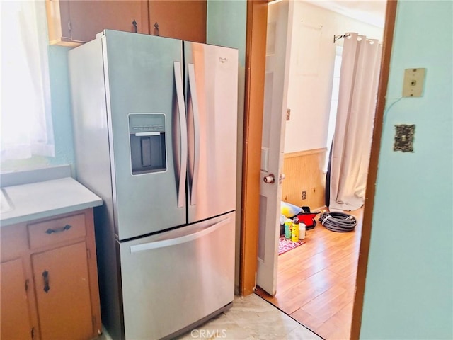 3424 Christie Ct, Sacramento, CA 95838 - kitchen featuring stainless steel refrigerator with ice dispenser, light countertops, plenty of natural light, and light wood finished floors