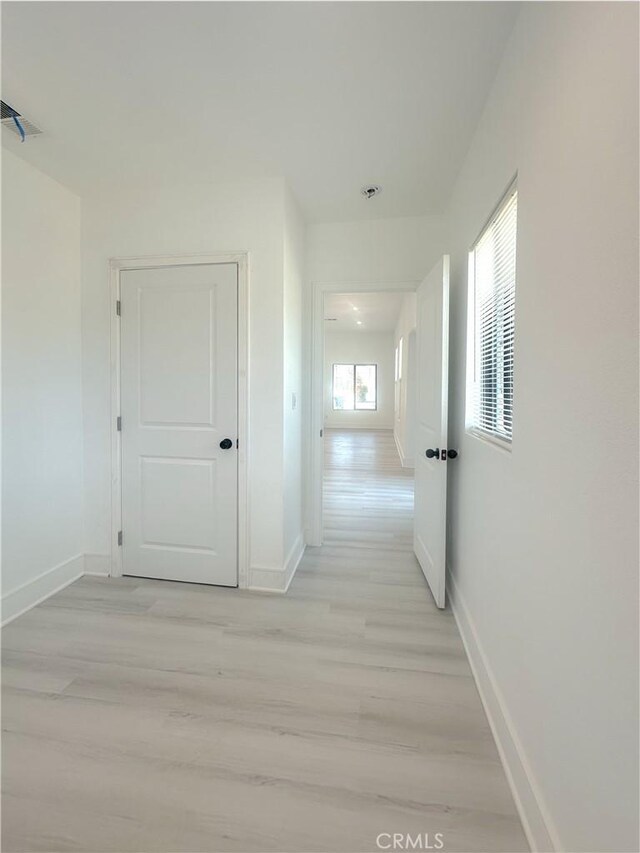 1295 E Whittier Ave, Hemet, CA 92543 - hall with baseboards and light wood-type flooring