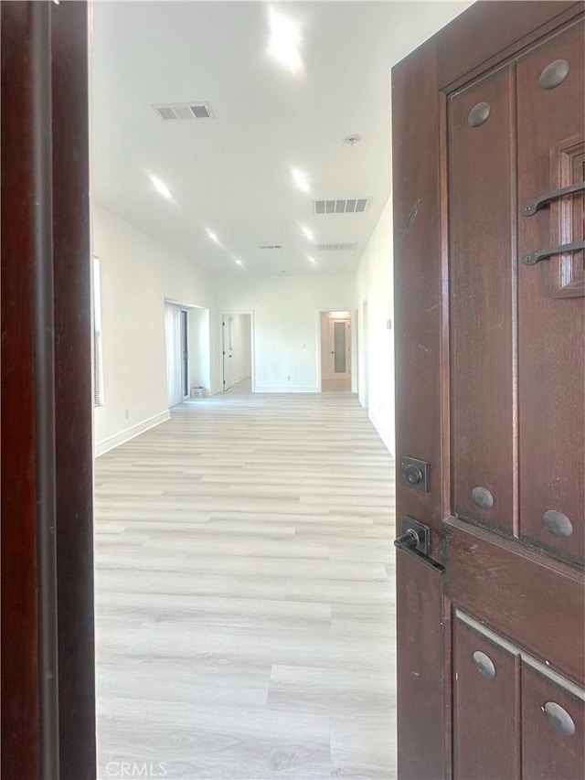 1295 E Whittier Ave, Hemet, CA 92543 - hall featuring baseboards and light wood-style flooring