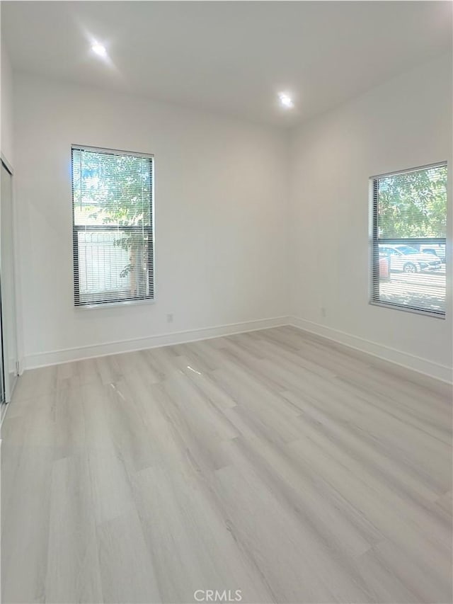 1295 E Whittier Ave, Hemet, CA 92543 - empty room featuring healthy amount of natural light, light wood-style flooring, and recessed lighting