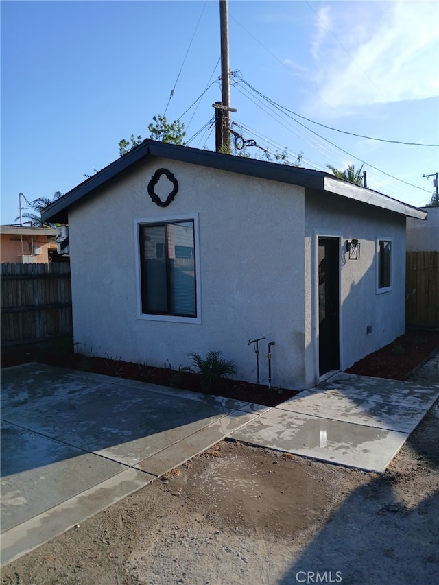 1295 E Whittier Ave, Hemet, CA 92543 - rear view of property with a patio area and stucco siding