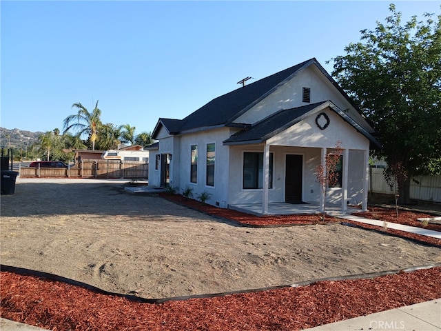 1295 E Whittier Ave, Hemet, CA 92543 - view of front of home with stucco siding and a porch