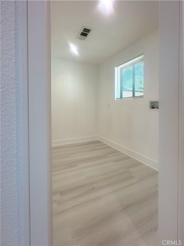 1295 E Whittier Ave, Hemet, CA 92543 - spare room featuring light wood-type flooring and baseboards