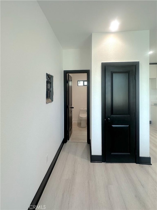 1295 E Whittier Ave, Hemet, CA 92543 - hallway featuring light wood finished floors and baseboards