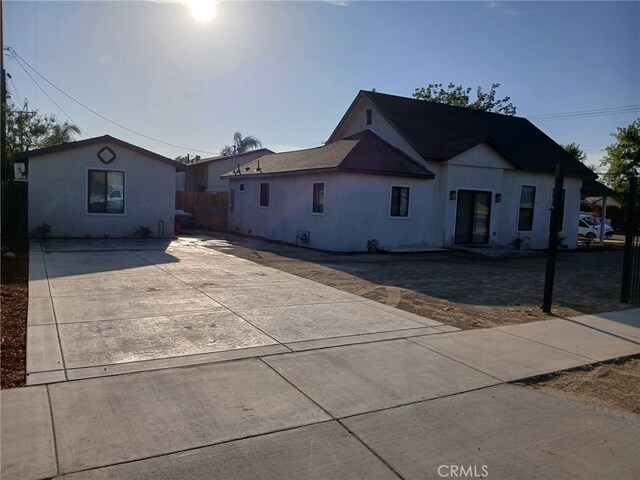 1295 E Whittier Ave, Hemet, CA 92543 - view of front of house with stucco siding and concrete driveway