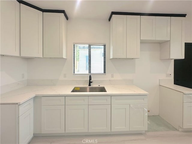 1295 E Whittier Ave, Hemet, CA 92543 - kitchen with white cabinetry and light stone counters