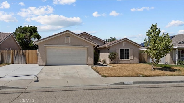 6327 W W Ave J5, Lancaster, CA 93536 - ranch-style home with a garage, stucco siding, and concrete driveway