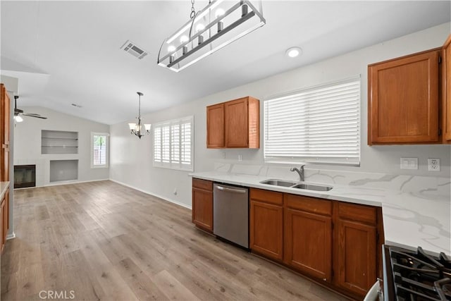 6327 W W Ave J5, Lancaster, CA 93536 - kitchen featuring stainless steel dishwasher, a chandelier, lofted ceiling, ceiling fan, and brown cabinetry