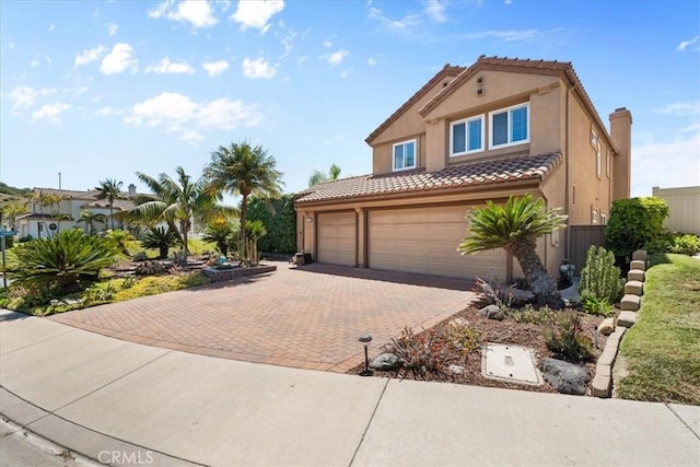 42 Paseo Alba, San Clemente, CA 92672 - mediterranean / spanish home featuring a tile roof, stucco siding, decorative driveway, and a garage