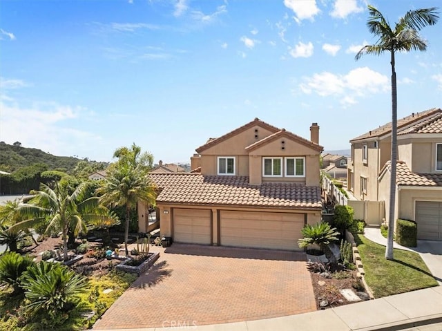 42 Paseo Alba, San Clemente, CA 92672 - mediterranean / spanish house with decorative driveway, stucco siding, a tile roof, and a garage