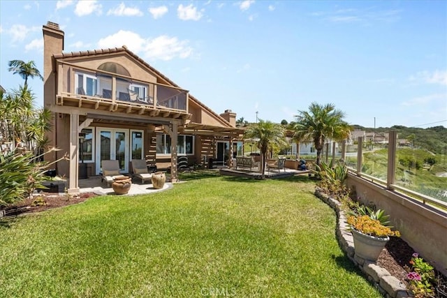 42 Paseo Alba, San Clemente, CA 92672 - back of house featuring a balcony, a patio, a chimney, french doors, and stucco siding