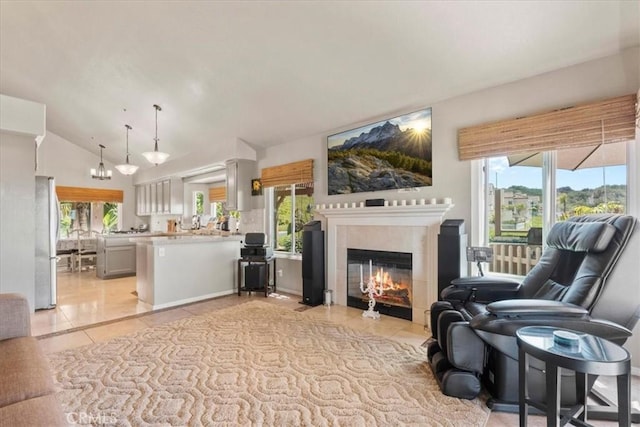42 Paseo Alba, San Clemente, CA 92672 - living room featuring light tile patterned floors, lofted ceiling, a fireplace, and plenty of natural light