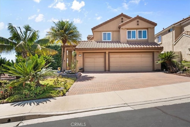 42 Paseo Alba, San Clemente, CA 92672 - mediterranean / spanish home featuring stucco siding, a tiled roof, decorative driveway, and an attached garage