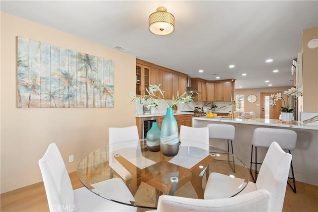 3273 Tilden Ave, Los Angeles, CA 90034 - dining space with recessed lighting, beverage cooler, and light wood finished floors