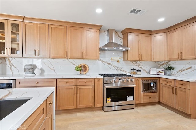 3273 Tilden Ave, Los Angeles, CA 90034 - kitchen with stainless steel appliances, wall chimney range hood, beverage cooler, tasteful backsplash, and light stone countertops