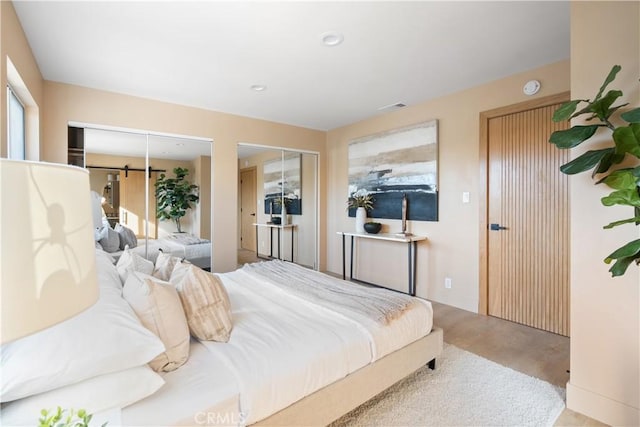 3273 Tilden Ave, Los Angeles, CA 90034 - bedroom featuring multiple closets, wood finished floors, and recessed lighting