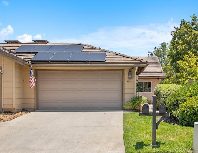 4346 Los Padres Dr, Fallbrook, CA 92028 - view of front of home featuring driveway, solar panels, an attached garage, a tiled roof, and a front lawn