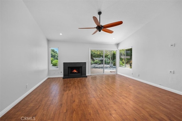 4346 Los Padres Dr, Fallbrook, CA 92028 - unfurnished living room featuring a ceiling fan, plenty of natural light, a brick fireplace, wood finished floors, and vaulted ceiling