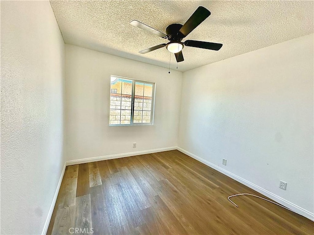 4727 Wilson St, Chino, CA 91710 - empty room featuring dark wood-type flooring, a ceiling fan, and a textured ceiling