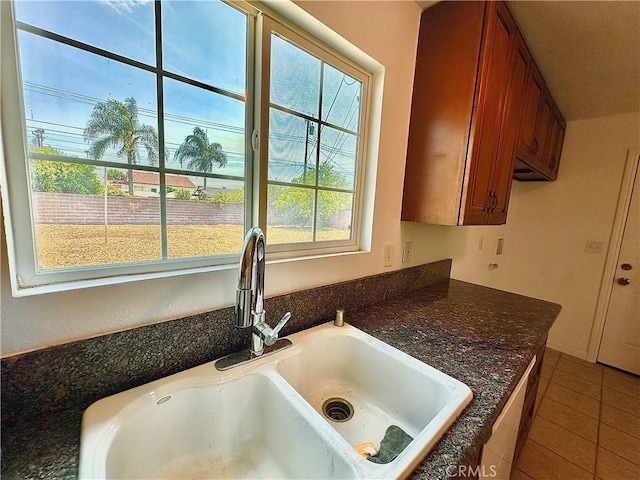 4727 Wilson St, Chino, CA 91710 - kitchen featuring brown cabinetry and tile patterned flooring