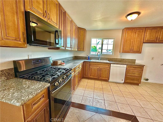 4727 Wilson St, Chino, CA 91710 - kitchen featuring dishwasher, stainless steel gas stove, black microwave, brown cabinets, and a textured ceiling