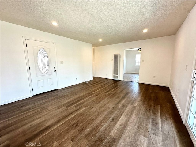 4727 Wilson St, Chino, CA 91710 - foyer entrance featuring a textured ceiling, a heating unit, ceiling fan, dark wood finished floors, and recessed lighting