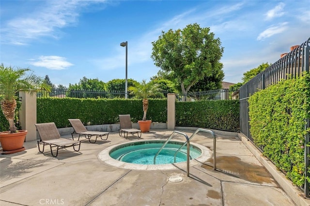 8718 E Indian Hills Rd Unit J, Orange, CA 92869 - view of pool featuring a community hot tub and a patio area