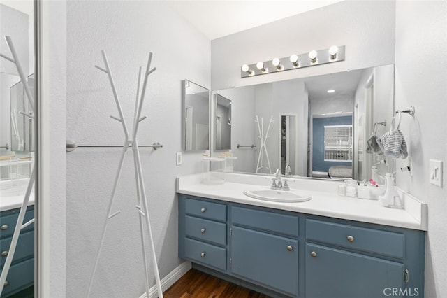 8718 E Indian Hills Rd Unit J, Orange, CA 92869 - ensuite bathroom featuring vanity and wood finished floors
