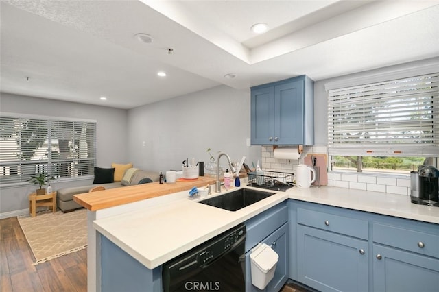 8718 E Indian Hills Rd Unit J, Orange, CA 92869 - kitchen with dishwasher, a peninsula, dark wood-style flooring, recessed lighting, and light countertops