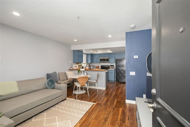 8718 E Indian Hills Rd Unit J, Orange, CA 92869 - living area featuring dark wood finished floors and recessed lighting