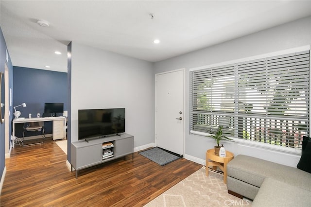 8718 E Indian Hills Rd Unit J, Orange, CA 92869 - living room with wood finished floors, recessed lighting, and a desk