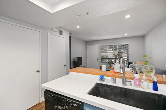 8718 E Indian Hills Rd Unit J, Orange, CA 92869 - kitchen with dishwasher, light countertops, recessed lighting, and wood finished floors